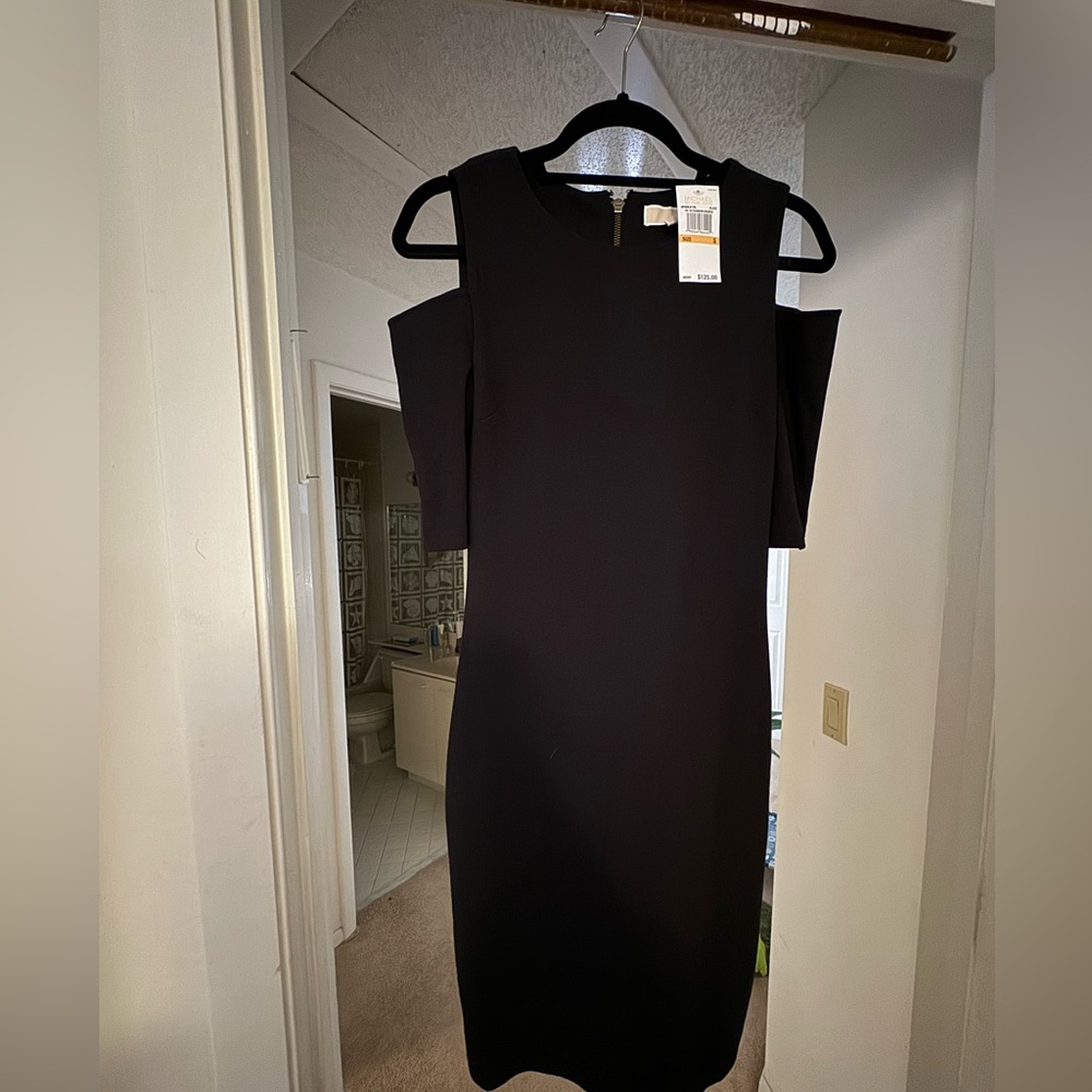 Never worn. Michael Kors cut out shoulders size 4